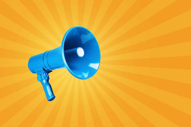 Creative vintage blue megaphone on a yellow background. Advertising and message concept. Creativity and traffic. Attention!