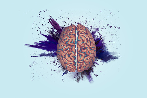 Creative brain explosion with splatter on blue light background. Brainstorming, concept. Think different, creative idea. Brain and explosion with paint splashes