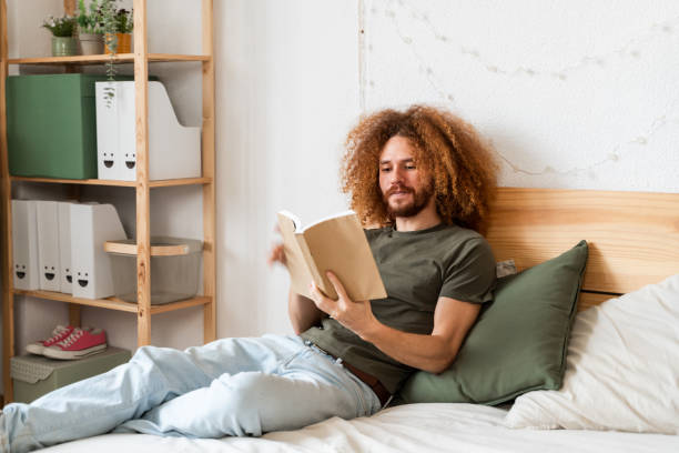 istock Engrossed in Reading in Cozy Bedroom 2018087216