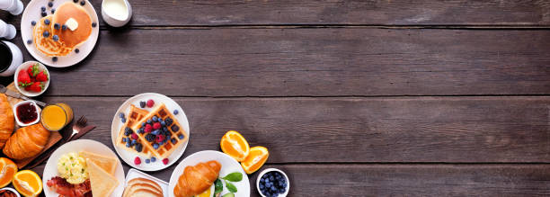 istock Breakfast or brunch corner border on a dark wood banner background. Top view. 2018089053