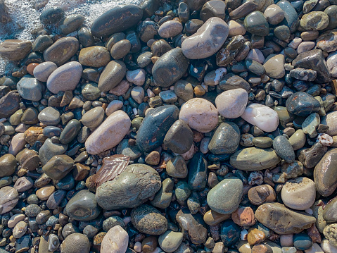 pebble stones on the beach as a background, nature series