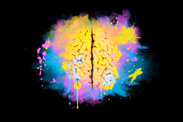 istock Creative brain explodes with splashes of pink, blue and yellow paint on a black background, concept. Creative idea and brainstorm. Artist thinking and creative process 2018098737