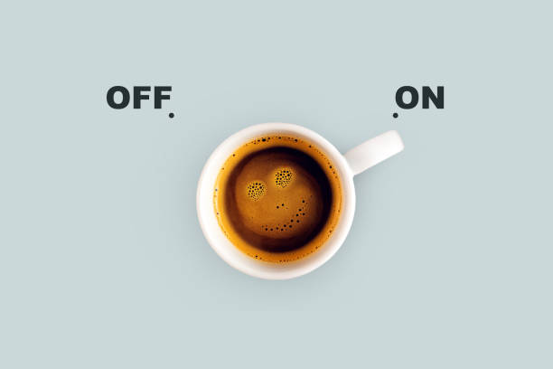 istock Delicious coffee with a smiley face on a blue background switch on. Energy switch, concept. Good morning, creative idea 2018098767
