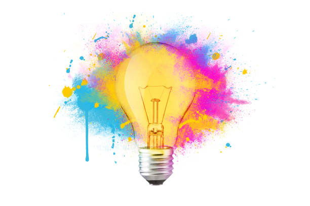 Creative colorful light bulb explosion with blue, yellow and pink splash on a white background, creativity idea. Light bulb and paint, concept. Think different. Paint with splashes