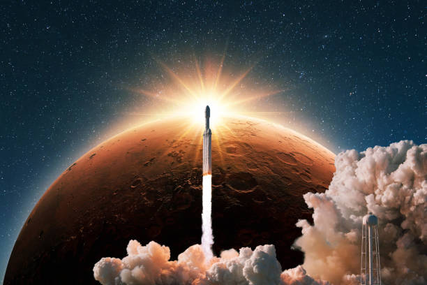 istock Space rocket with smoke and blast successfully launching to the red planet mars with sun rays. New spaceship lift off into starry space at sunset. Start of a space mission. Rocket, concept 2018098890