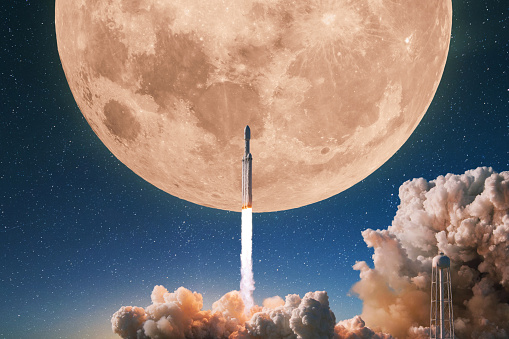 Space rocket successfully launches into the starry sky with a full moon. Spaceship rocket takes off into space. Start up of a space mission, concept