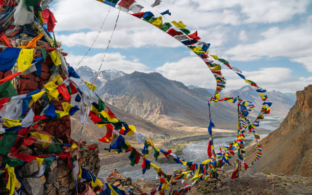 istock Prayer flags blow in the wind over Spiti river and Himalayas. Ka 2018099331