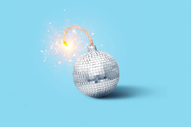 Disco mirror ball bomb with wick and sparks on blue background, creative idea. New Year and Christmas. Explosive music, concept