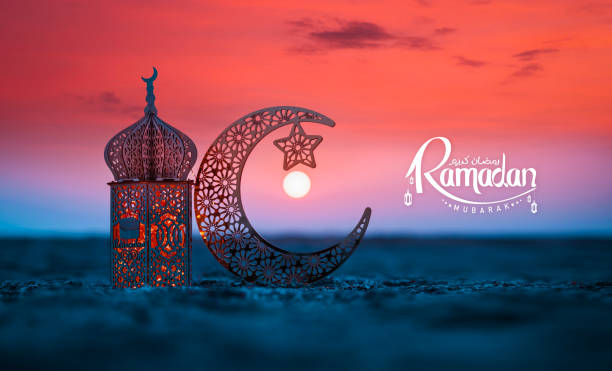 istock Islamic Lantern lamp with crescent moon on the beach 2018100299