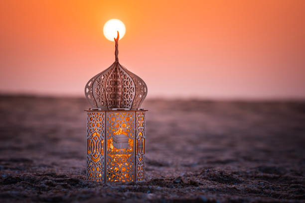 istock Ramadan Lantern lamp on the beach with sunset view 2018101883