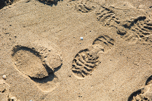 Footprint on a sandy beach, Semporna, Sabah, Malaysia.