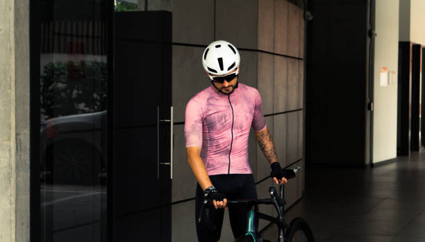 istock professional cyclist wearing a pink jersey getting out from his house 2018173812