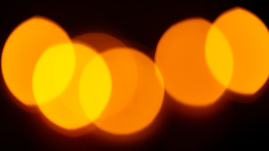 Abstract Defocussed Orange Lights on Dark Background, Christmas and New Year Background