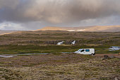 Camper van parked at the side of the road at Dynjandi heath in summer in the Westfjords, Iceland