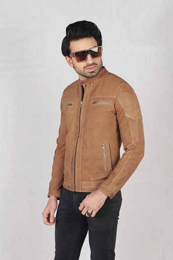 Male model posing in brown leather jacket
