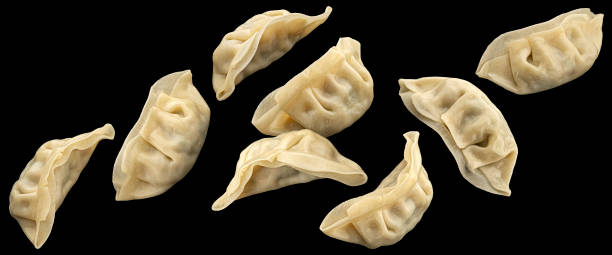 istock Chinese Gyoza dumplings isolated on black background 2018255275