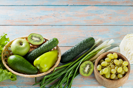 Green Fruits and Vegetables on Vintage Painted Boards, Copy Space