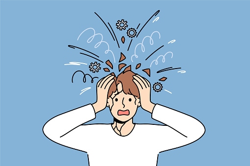Psychological unbalanced man feels head explode due to excessive worries caused by stress. Overload of thoughts and mental pressure became reason for psychological breakdown or panic attack