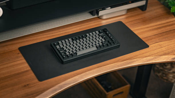 Black/Grey Keyboard On Wooden Desktop
