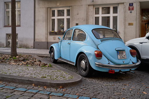 Prague, Czech Republic: Nov 08 2022 - Vintage light blue Volkswagen VW Beetle car Volkswagen Type 1 aka Volkswagen Bug released circa 1960 in Germany parked on the street.