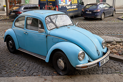 Prague, Czech Republic: Nov 08 2022 - Vintage light blue Volkswagen VW Beetle car Volkswagen Type 1 aka Volkswagen Bug released circa 1960 in Germany parked on the street.