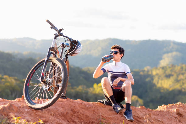 istock Cyclist enjoying a break atop a mountain 2018330104