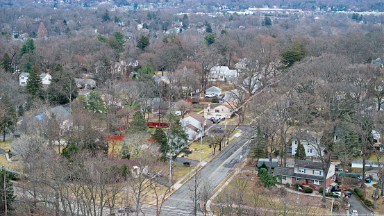 Aerial view of homes in an Upper middle class neighborhood.