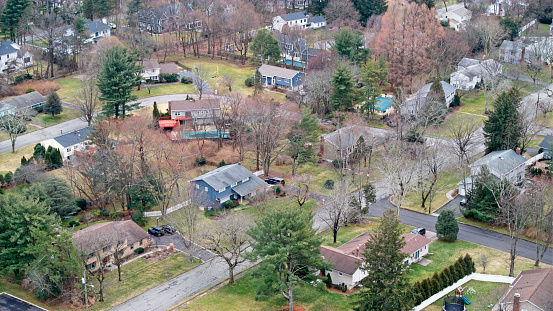 Aerial view of homes in an Upper middle class neighborhood.
