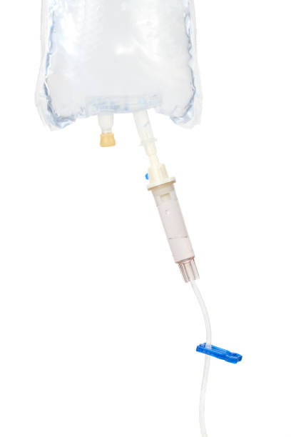 istock Isolated IV fluid bag with gravity drip and clamp. 2018337372