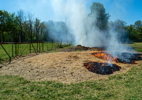 Weather conditions were perfect for a much needed controlled burn to get rid of old straw and hay in this Missouri pasture.