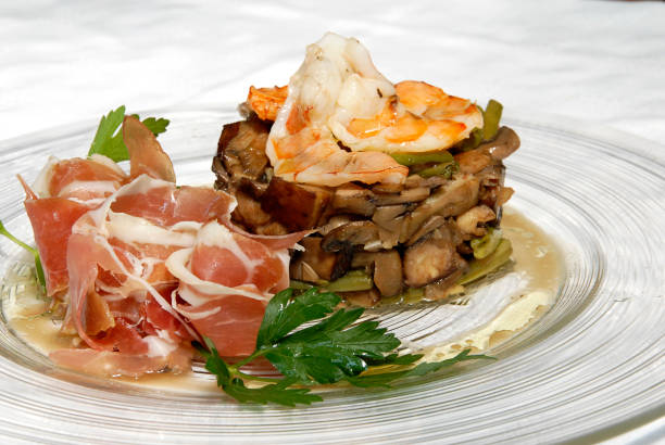 Iberian ham, serrano ham dish with pork and shrimp on white background
