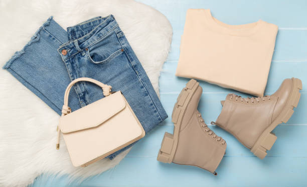 istock Flat lay with trendy spring outfit on wooden background, top view 2018382889