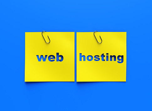 Web hosting text on paper. Word web hosting on torn paper. Concept