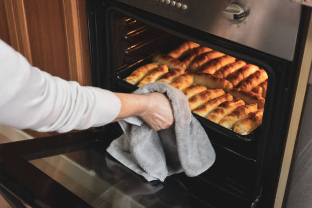 freshly baked croissants taken out of oven - gourmet pastry bread horizontal imagens e fotografias de stock