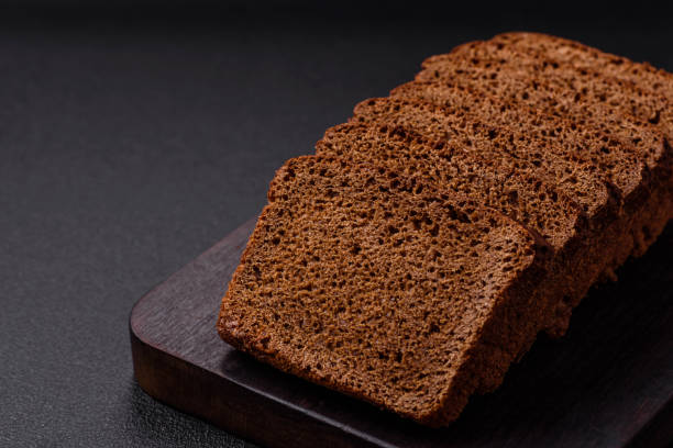 istock Delicious brown bread with seeds and grains cut into slices 2018427394