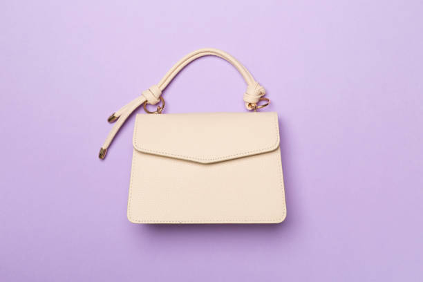 istock Fashionable leather bag on color background, top view 2018457770