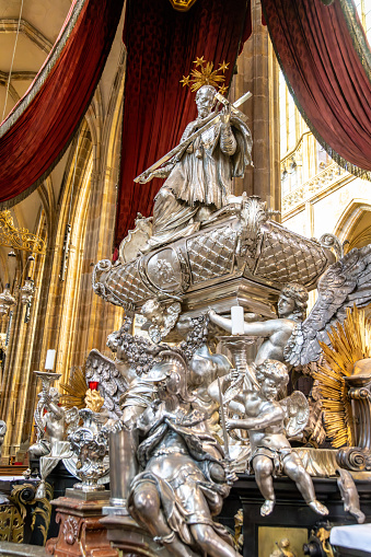 Prague, Capital City of Prague - Czech Republic - 09-21-2022: Ornate religious sculpture in Prague cathedral, showcasing intricate silver work and golden accents