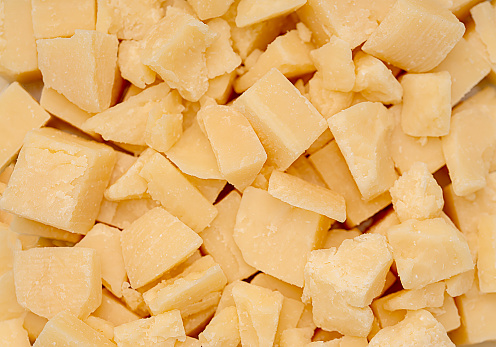 Macro blank photography of cheese parmesan, hard, Italian, dairy, appetizer, parma, savoury, cutting, cube, snack, slice