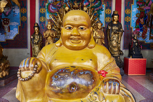 Buddha statues red and gold in the temple in Thailand.