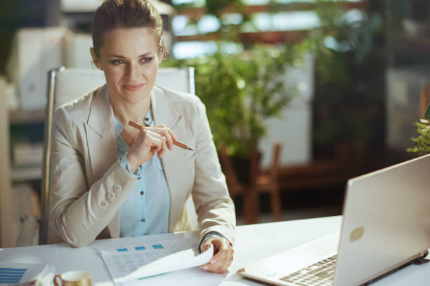 istock pensive modern accountant woman in modern green office 2018582051