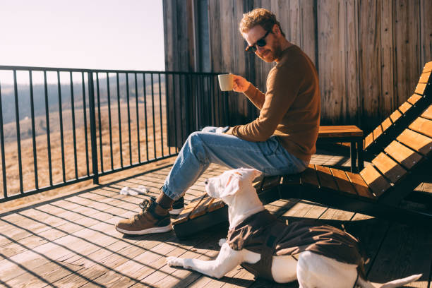 Man Enjoying Sunny Day Outdoors with His Dog