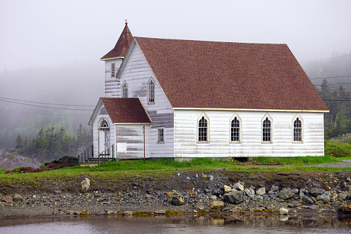 Old wooden church on a misty summer morning near Twillingate, Newfoundland