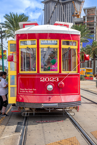 New Orleans, USA - October 25, 2023: people in New Orleans use the street car in early morning to go to town and work.