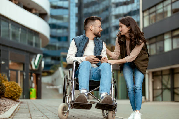 istock Disabled Couple Talking Outdoors 2018649433