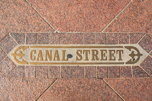 brass inlet Canal street in New Orleans at the sidewalk of Canal street, Louisiana, USA