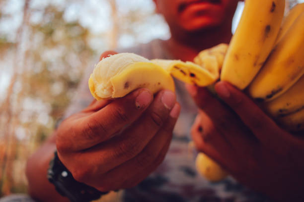 brown man enjoy banana