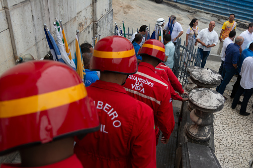 Salvador, Bahia, Brazil - December 08, 2023: Soldiers from the fire department provide assistance during a mass in honor of Conceicao da Praia in the city of Salvador, Bahia.