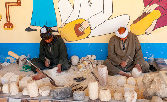 Egypt,  Marsa Alam - March 01, 2019: imitation of the production of alabaster vases near a tourist shop, Egypt