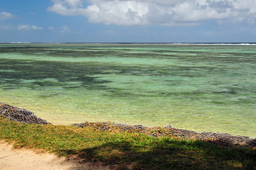 Rivière Des Galets, Savanne District, Mauritius: Saint Felix public beach - calm turquoise waters protected by the coral reef and gabions lining the beach for erosion and rising sea level containment.