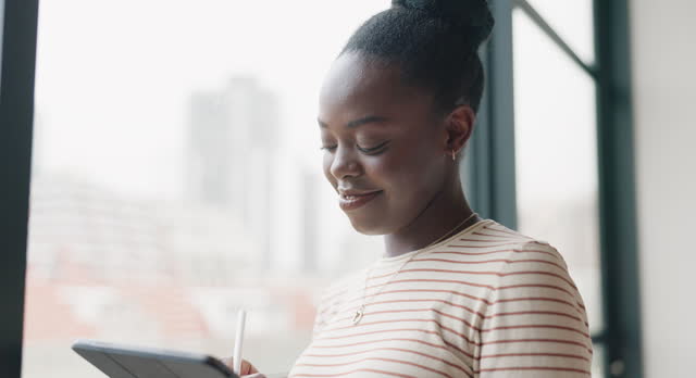 Thinking, business and black woman at window with tablet, writing ideas or insight for agenda. Reflection, inspiration and entrepreneur planning online report, review or calendar schedule for startup